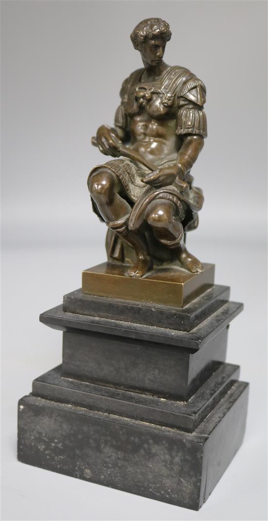 A classical seated figure of a man